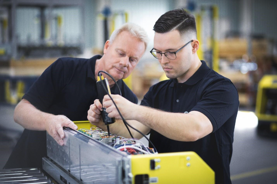 Working on a shuttle that is used in logistics solutions (photo: psb intralogistics GmbH) 