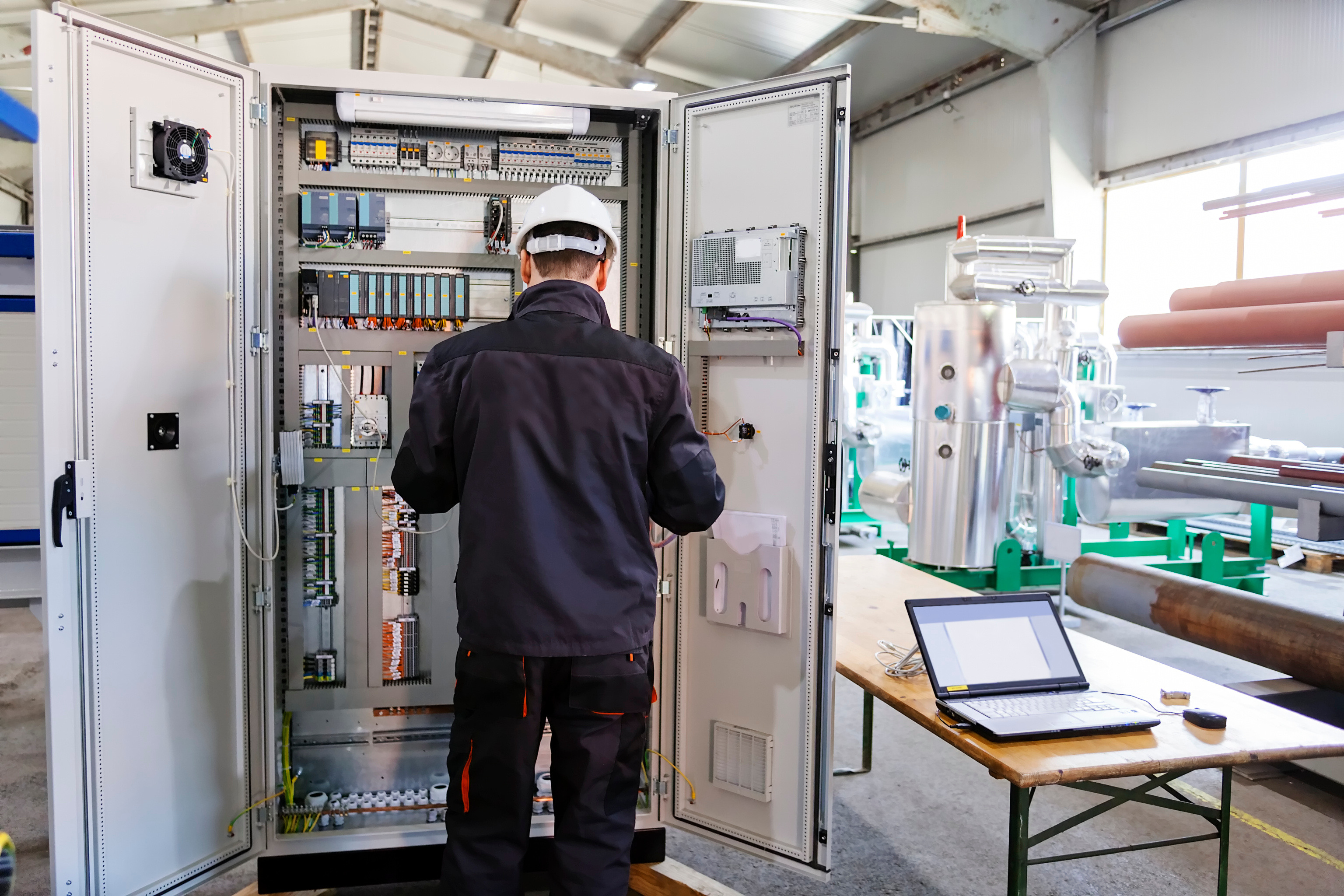 A panel builder works on a control panel