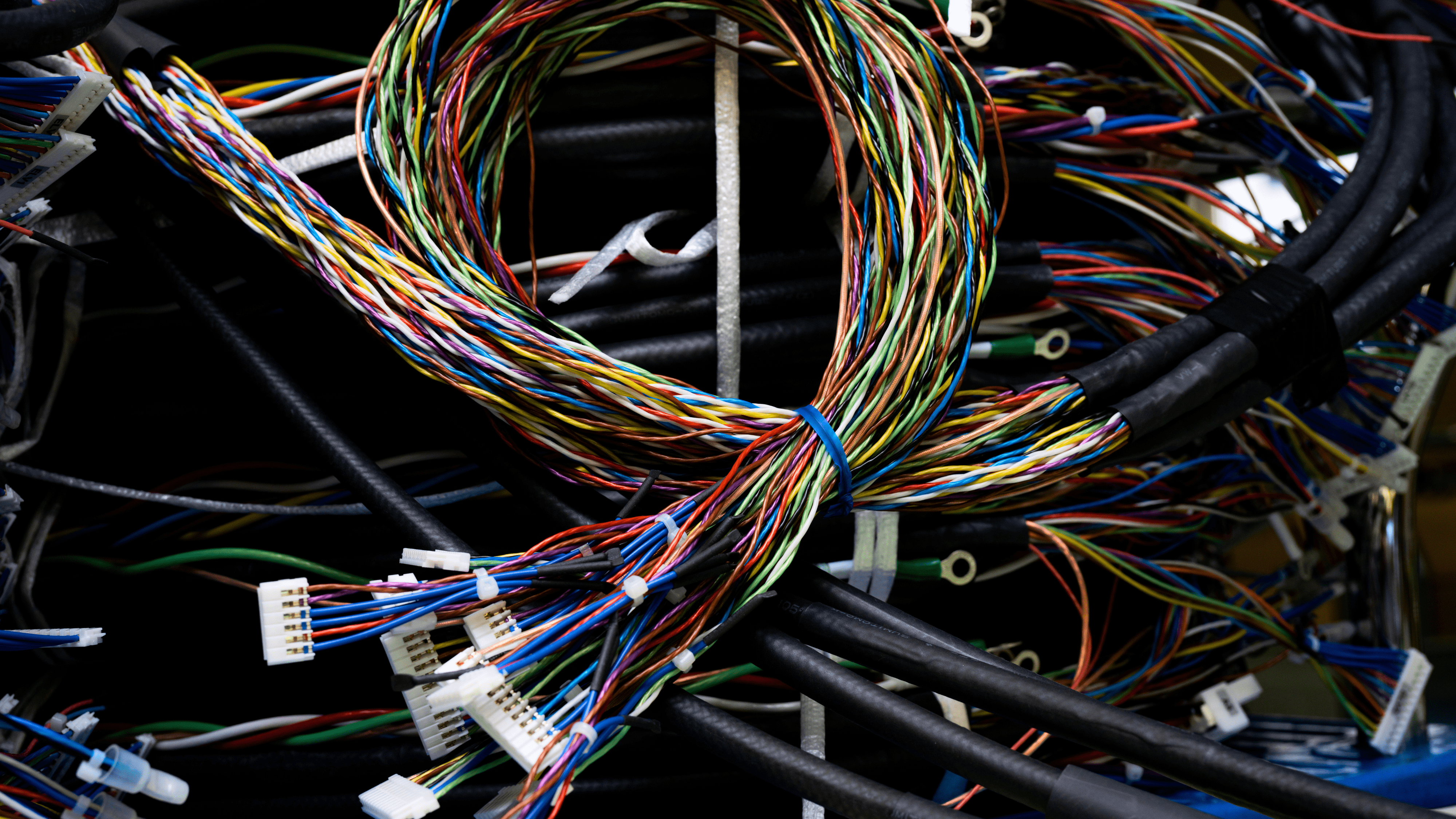 A bundle of electrical wires well organised due to the engineer using electrical computer-aided design to make the task easier.