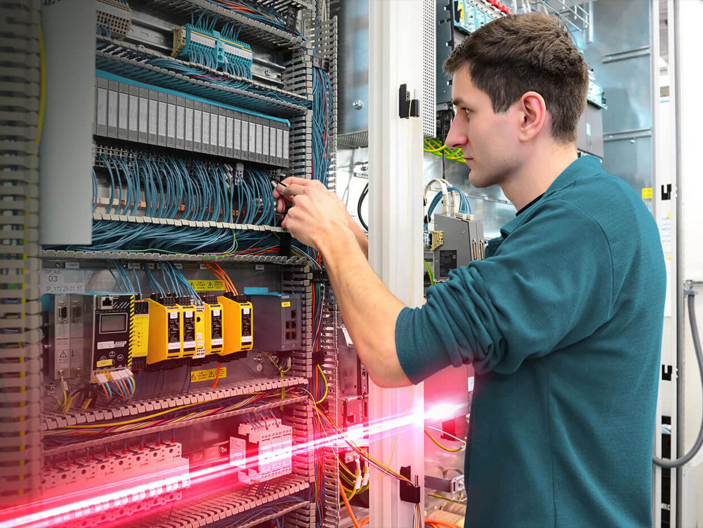 Engineers working on electrical panel building automation. 