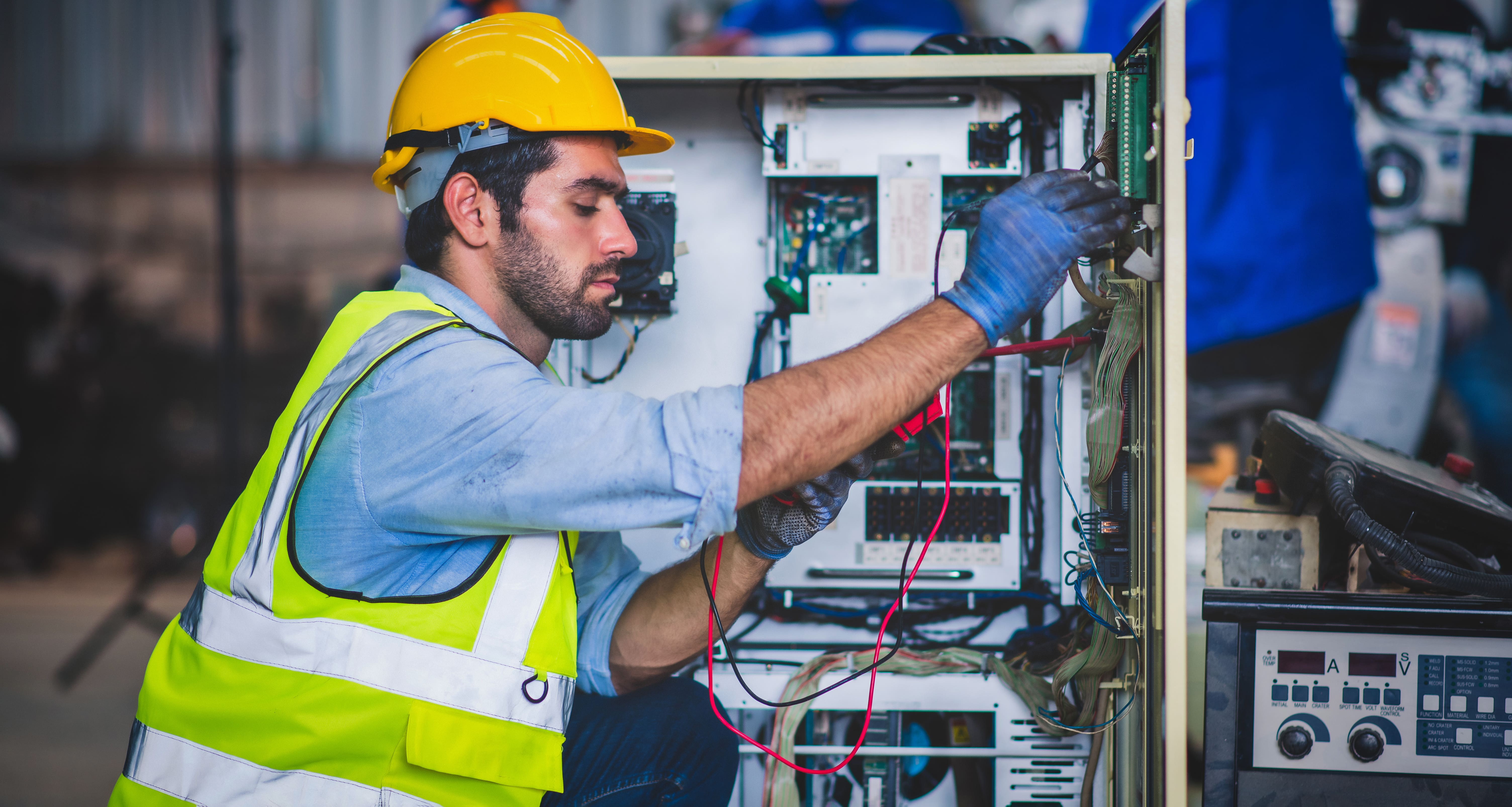 An electrical panel builder who is being benefitted by digital twin technology at work.